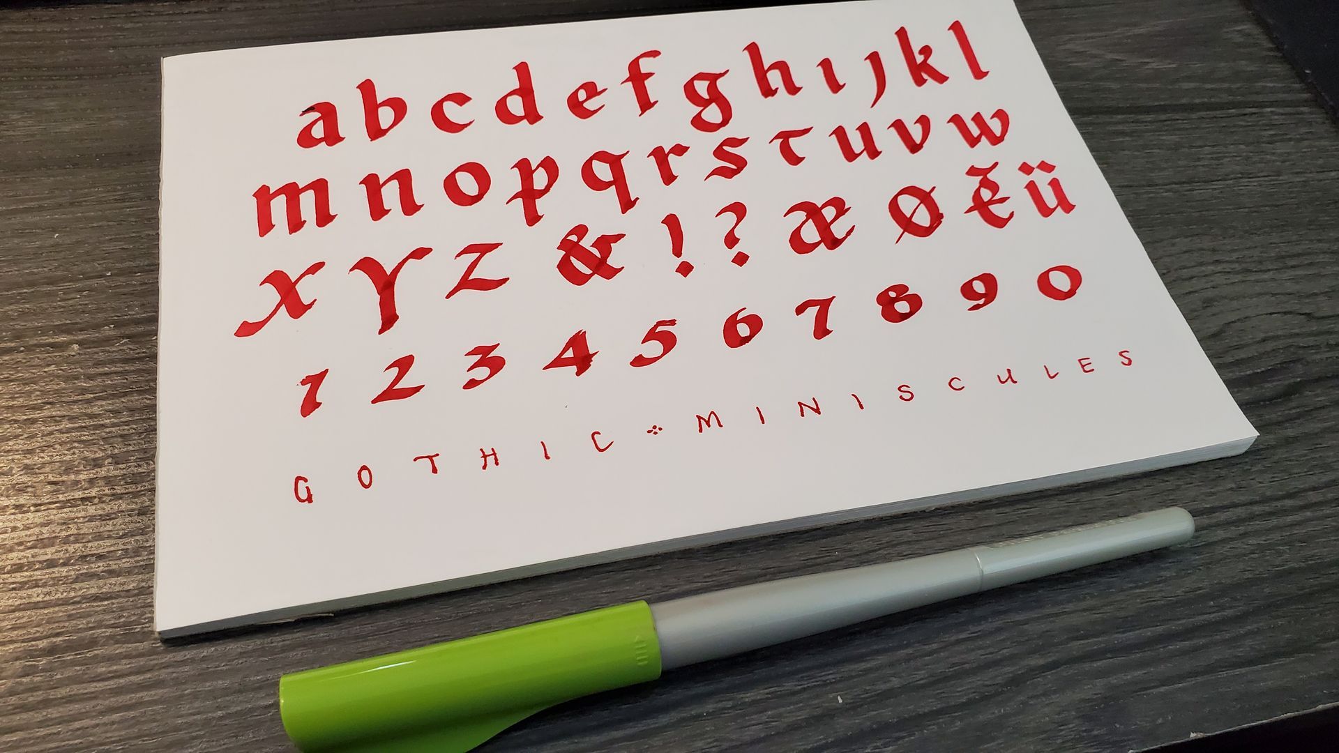 A piece of paper with the alphabet and numbers on it