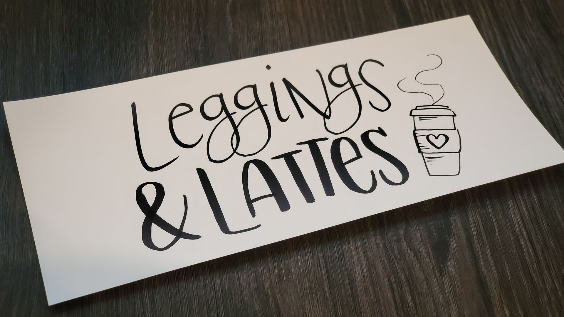 A piece of paper that says leggings and lattes on it