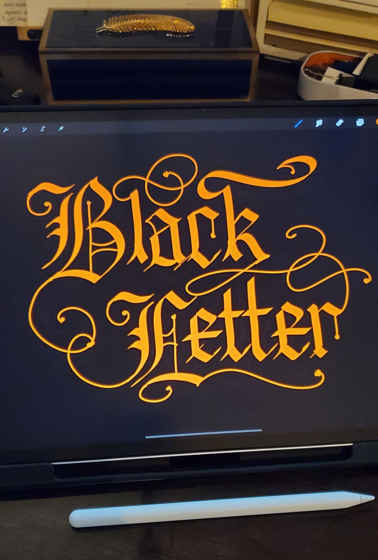A tablet with the words black letter on it