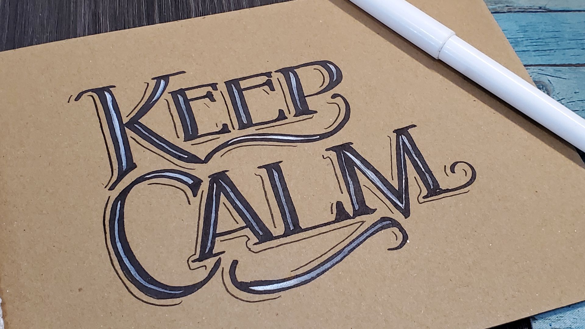 A piece of paper with the words keep calm written on it
