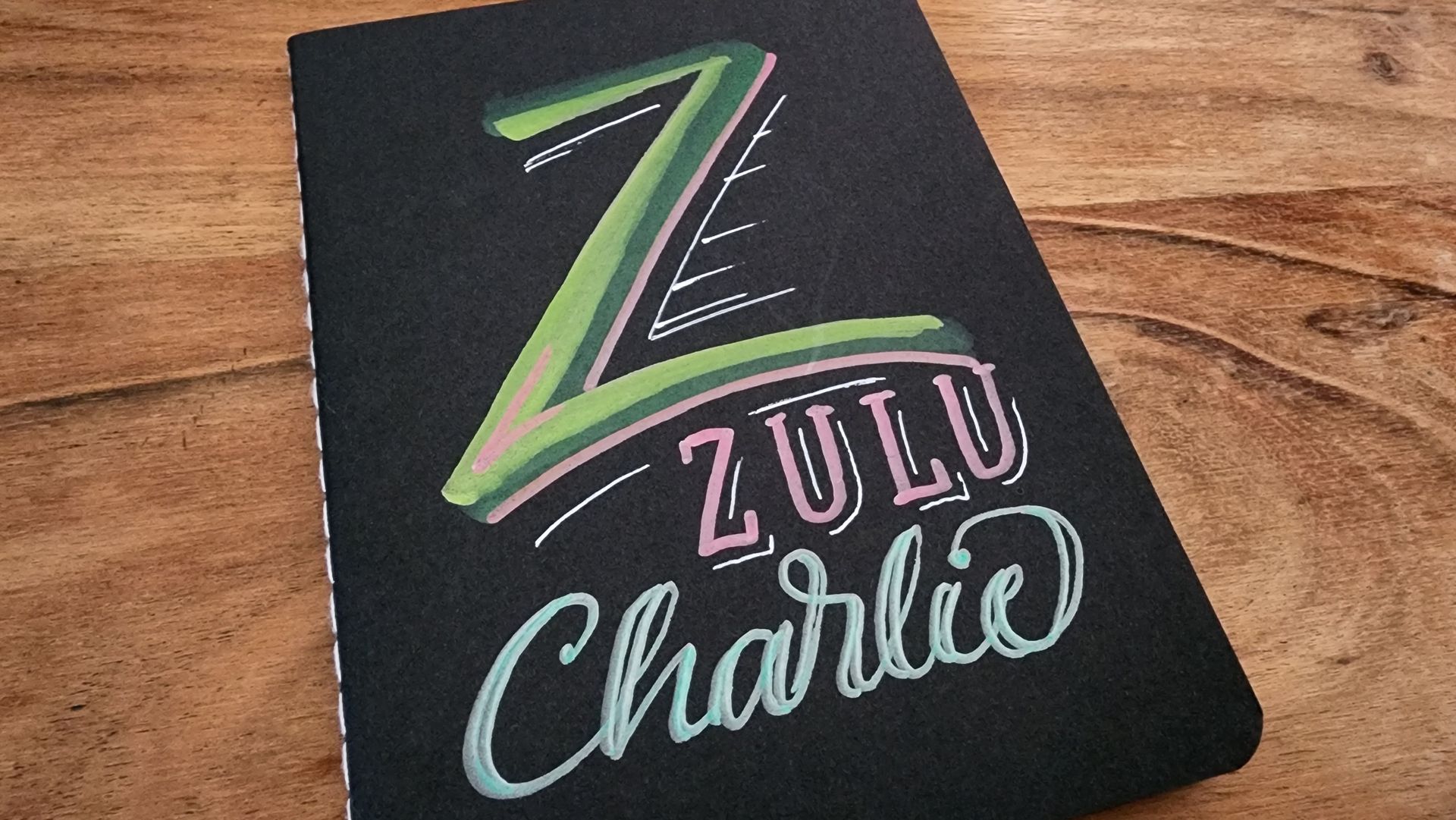 A black book with zulu charlie written on it