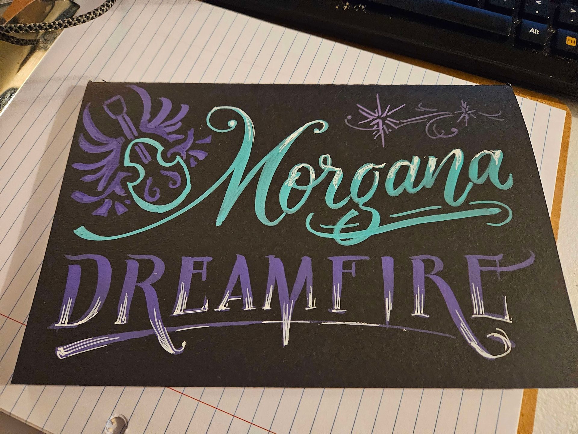 Acrylic chalk paint on matte black journal cover for Twitch user Morgana Dreamfire