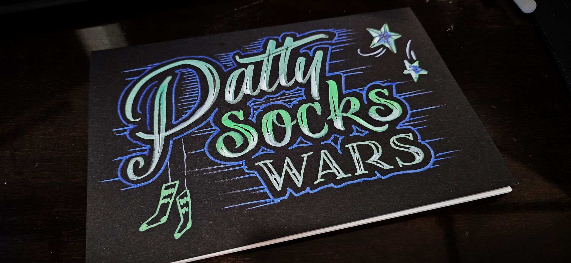 Acrylic chalk paint on matte black journal cover for Twitch user PattySocksWars