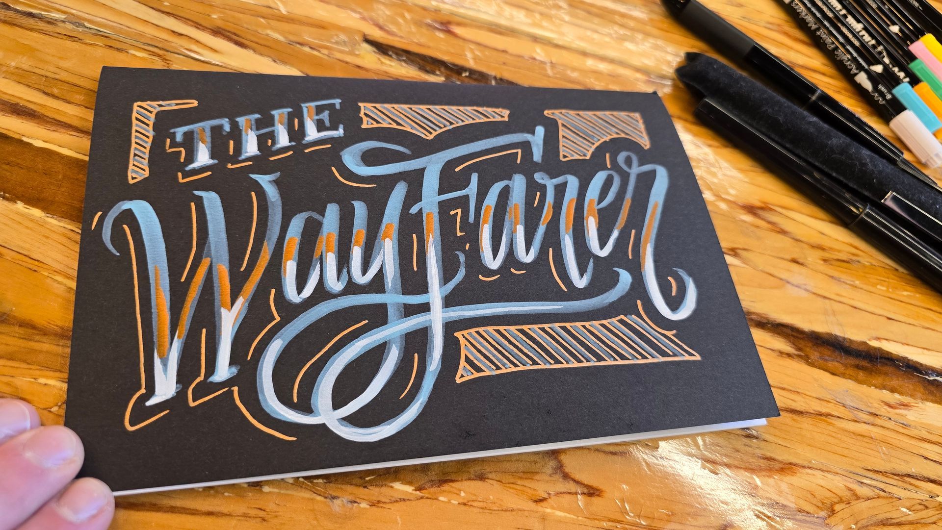 Acrylic chalk paint on matte black journal cover for Twitch user BertTheWayfarer