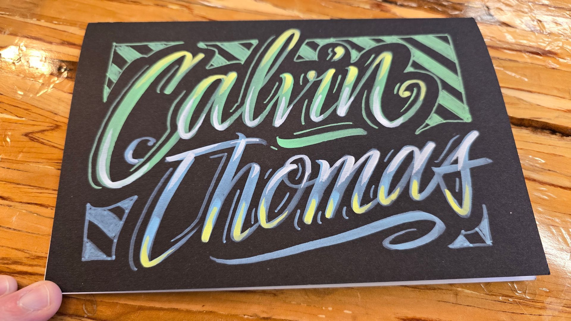 Acrylic chalk paint on matte black journal cover for Twitch user Calvin Thomas Music