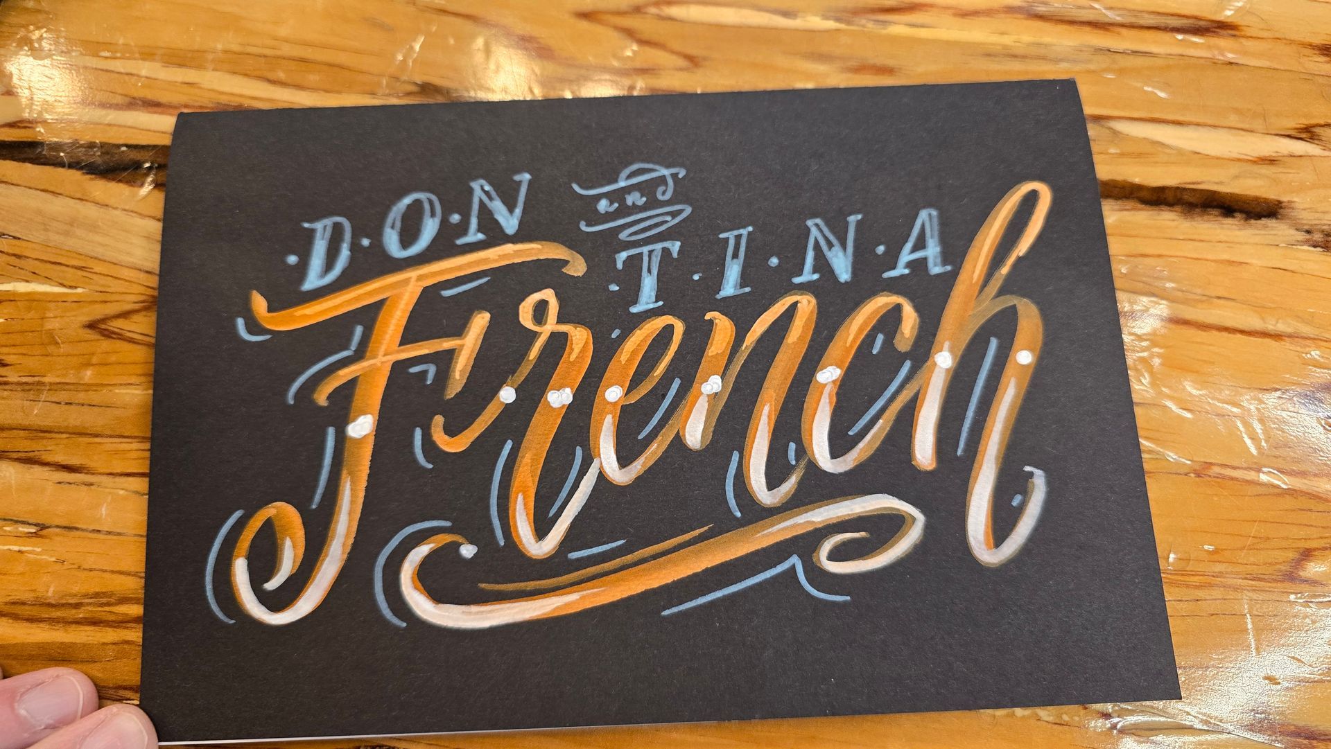 Acrylic chalk paint on matte black journal cover for Twitch user Tina French and her husband Don