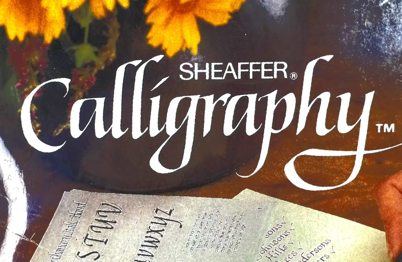 A book called calligraphy by sheaffer sits on a table