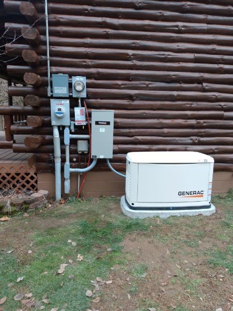 A Hvac System attached to the side of a log cabin. Sugarcreek Oh