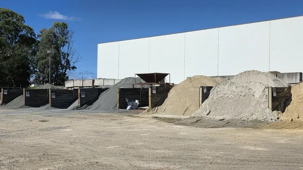 Piles of dirt are sitting in the yard of garden city landscape centre