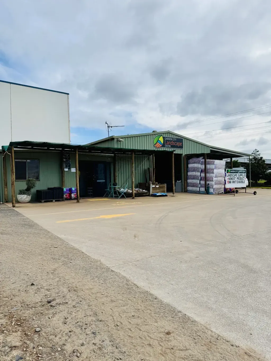 A large building with a lot of boxes in front of it.