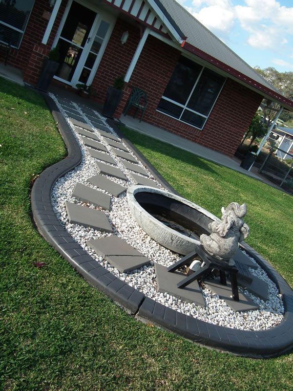 A brick house with a fire pit in front of it