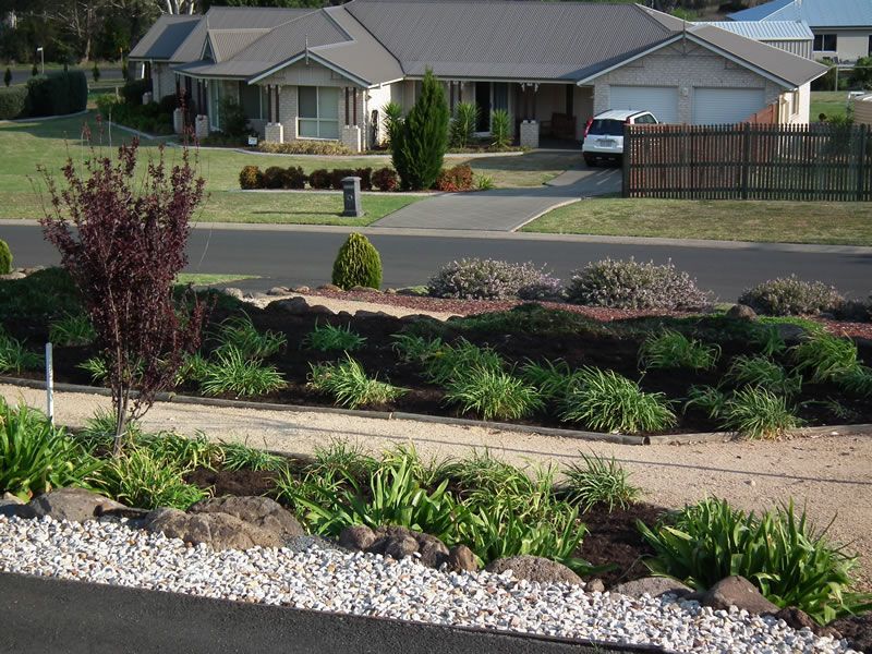 A house with a car parked in front of it