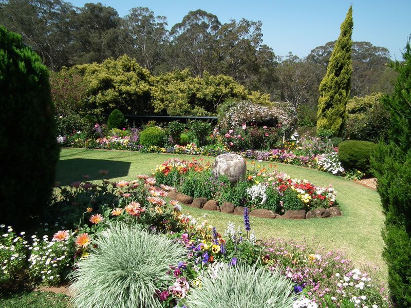 A garden filled with lots of flowers and trees