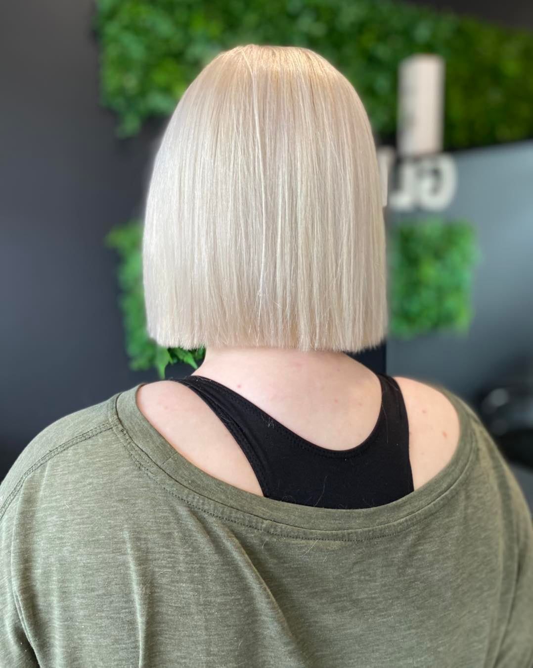 A Woman With Blonde Hair is Wearing a Green Shirt and a Black Tank Top β Glam Hair and Beauty in Woy Woy, NSW