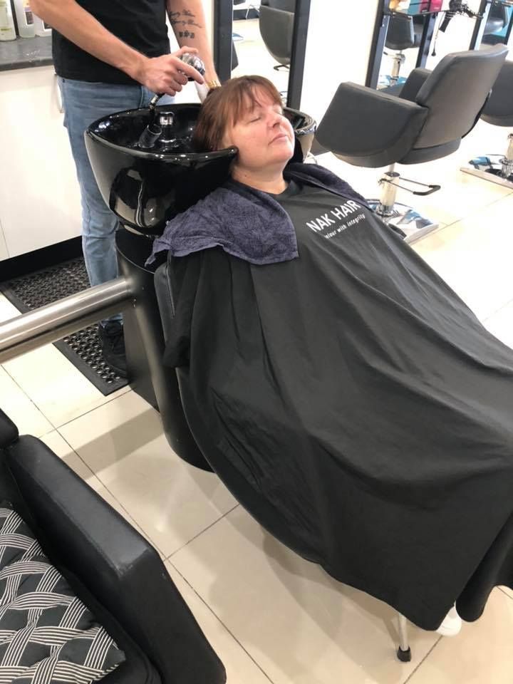 A row of chairs and mirrors in a hair salon — Glam Hair and Beauty in Woy Woy, NSW
