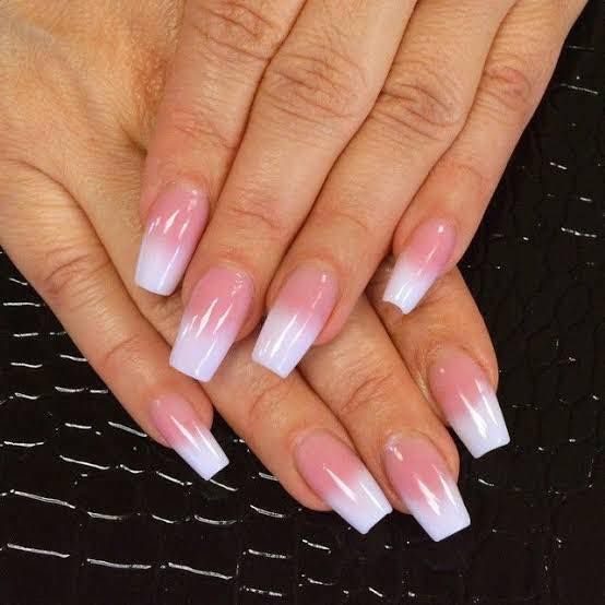 A woman 's hand with long pink and white nails — Glam Hair and Beauty in Woy Woy, NSW