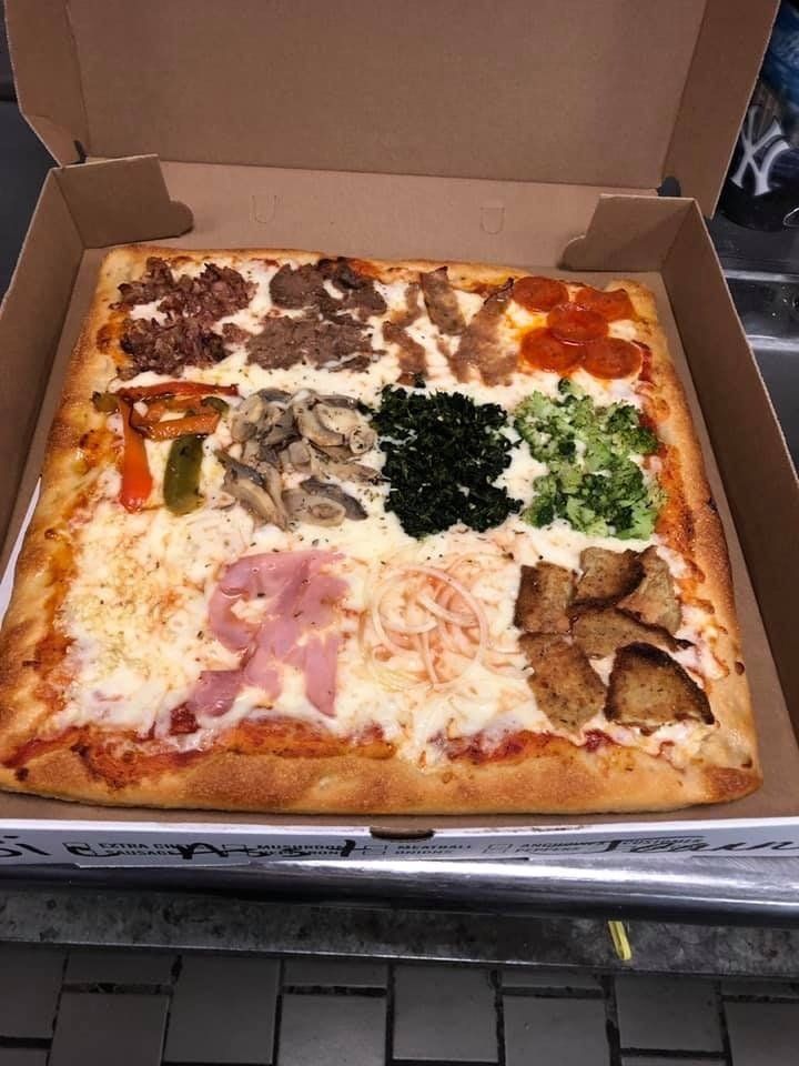 pizza with many different toppings