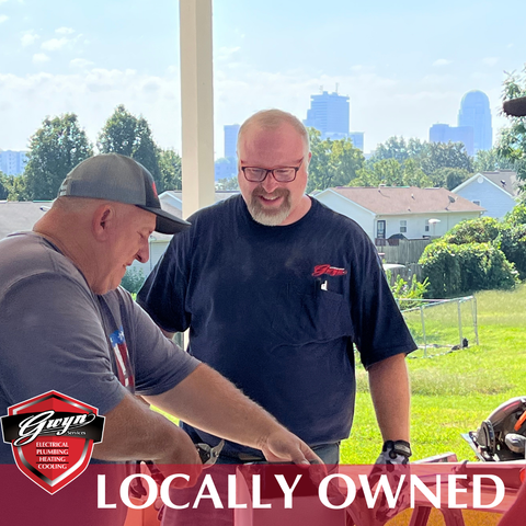 Two men are standing next to each other on a porch with a sign that says locally owned