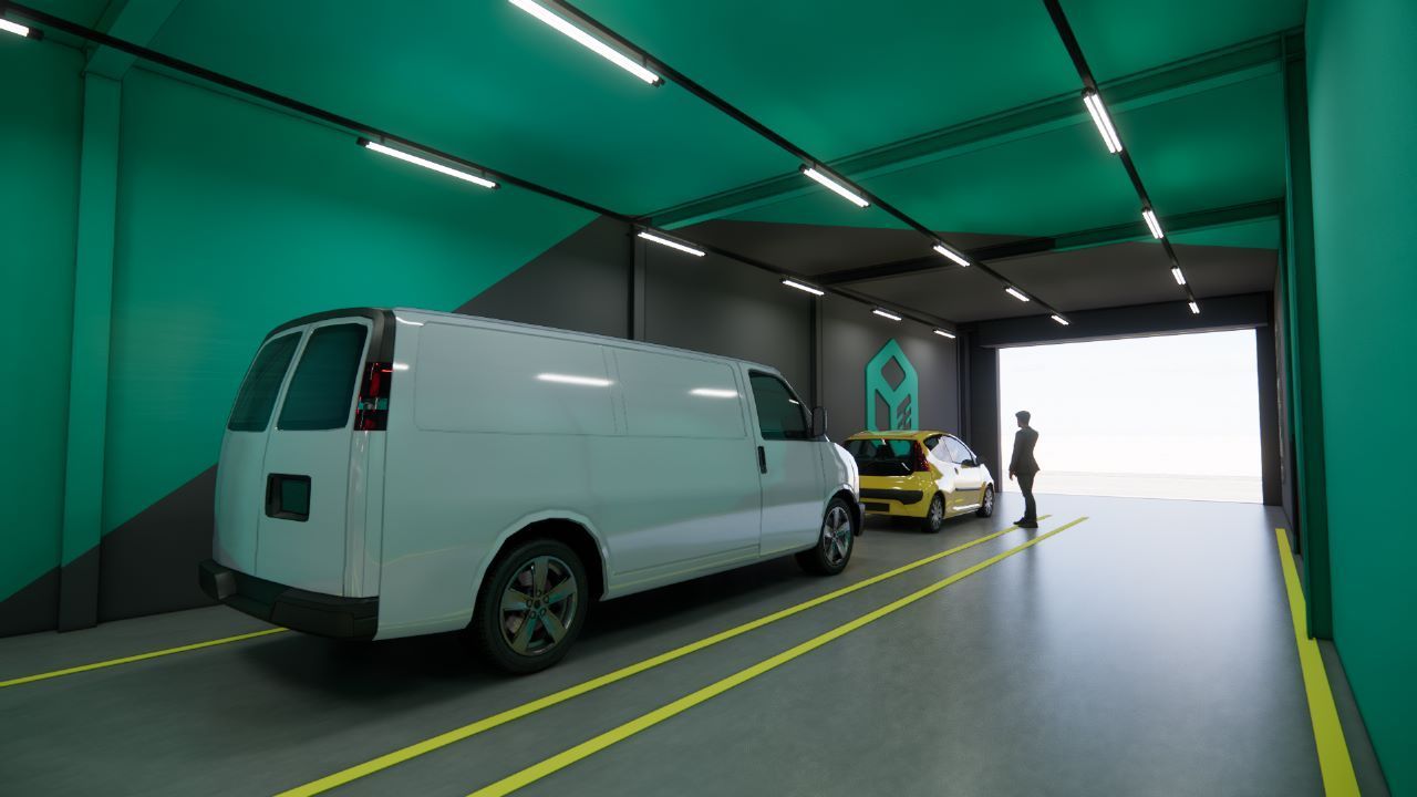 Uma van branca está estacionada em We Box Self Storage uma garagem ao lado de um carro amarelo.