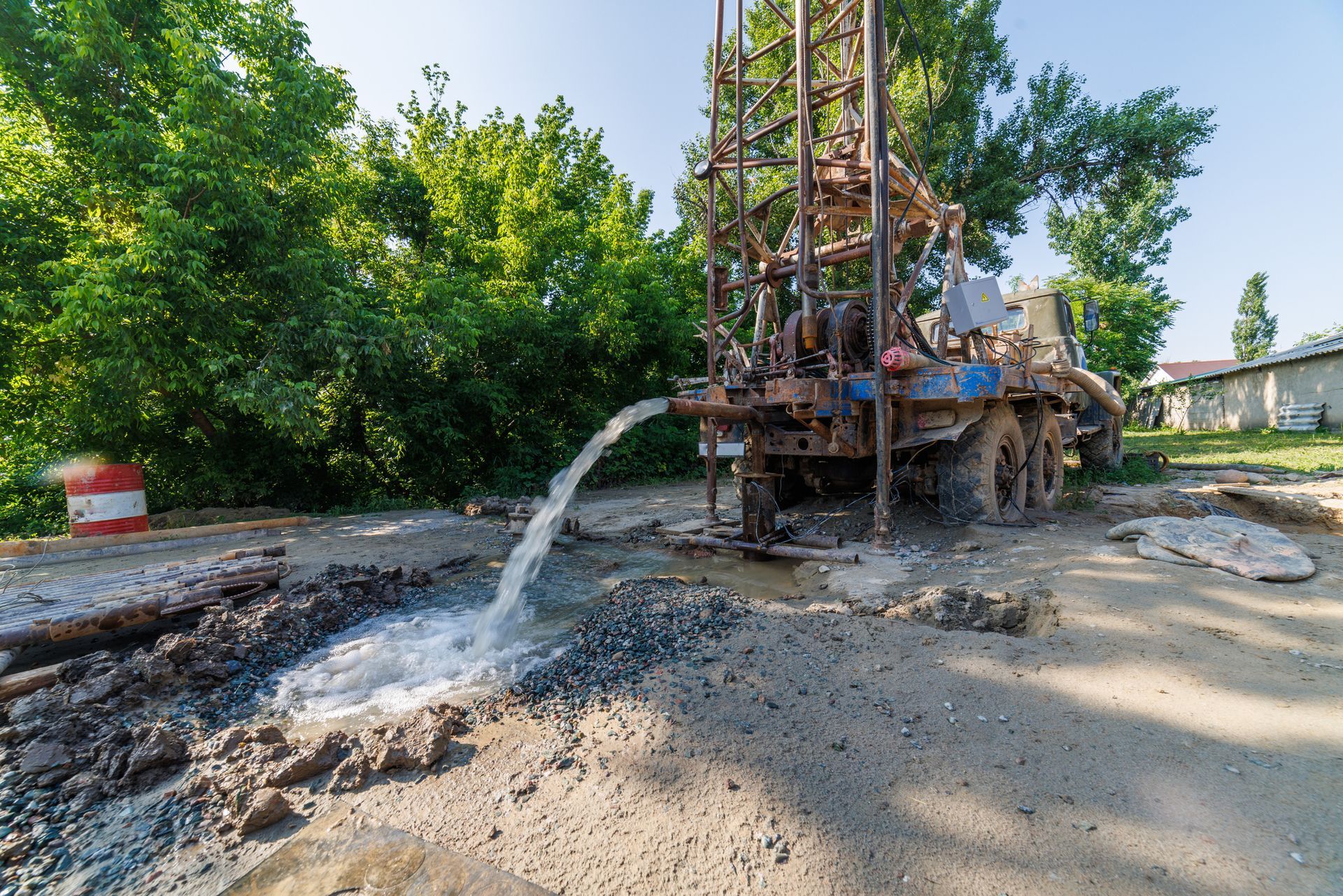 Water flows from a drilling rig during groundwater extraction.