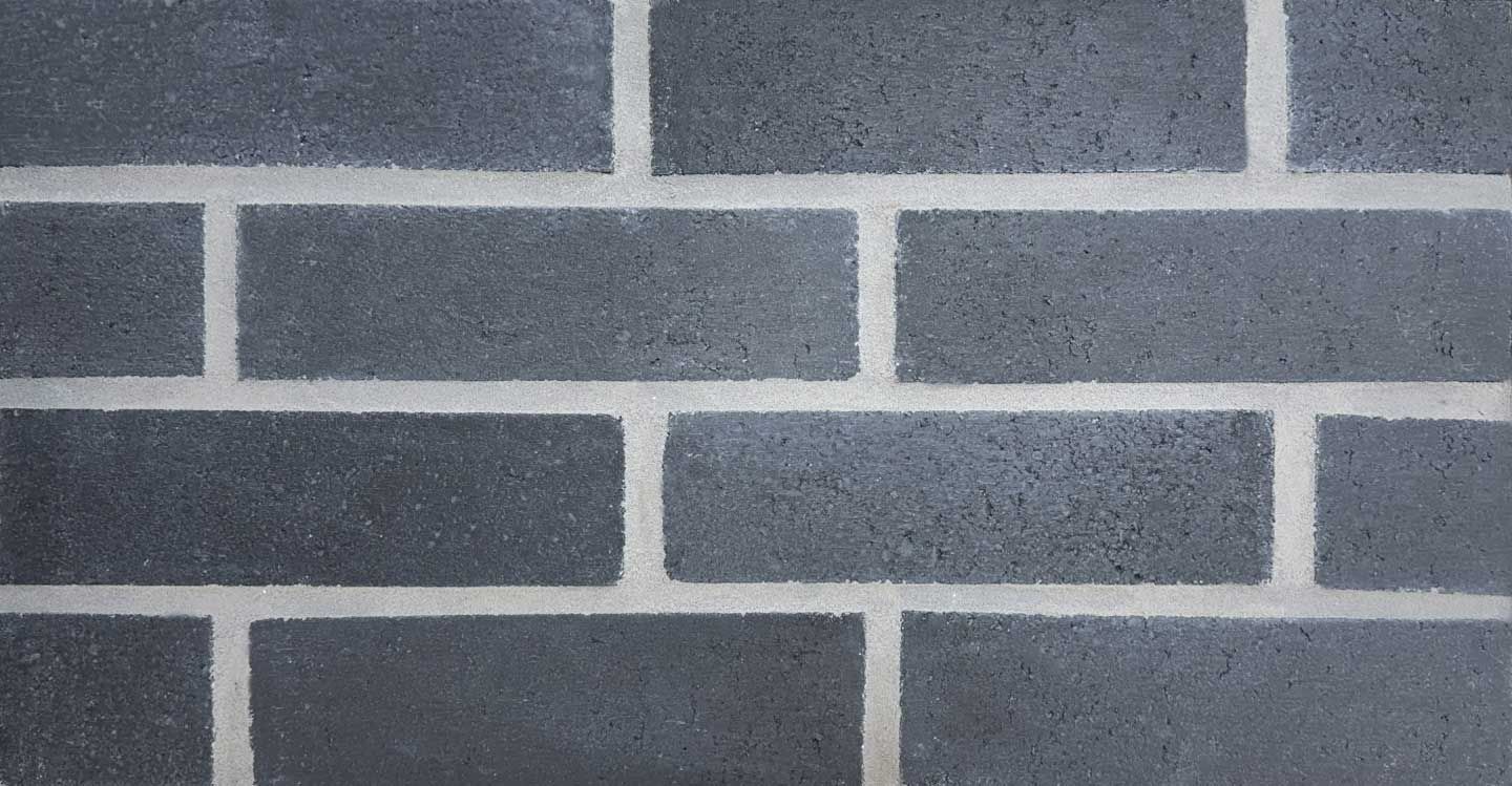 Gray cinder block wall with white mortar.