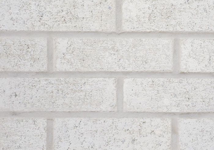 White brick wall with visible mortar.