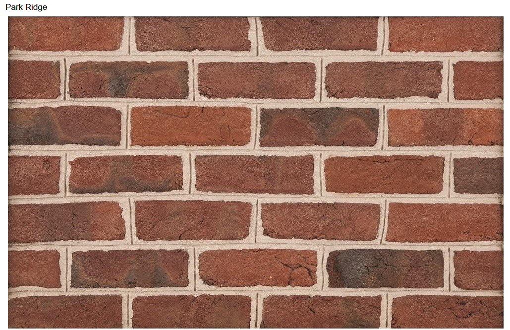 Brick wall with red and brown bricks.