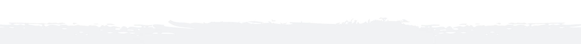 Skyline silhouette against a white gradient background, likely representing a city or horizon.