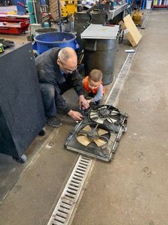Technician Working Among with Kid at J & S Automotive - Boulder Auto Repair
