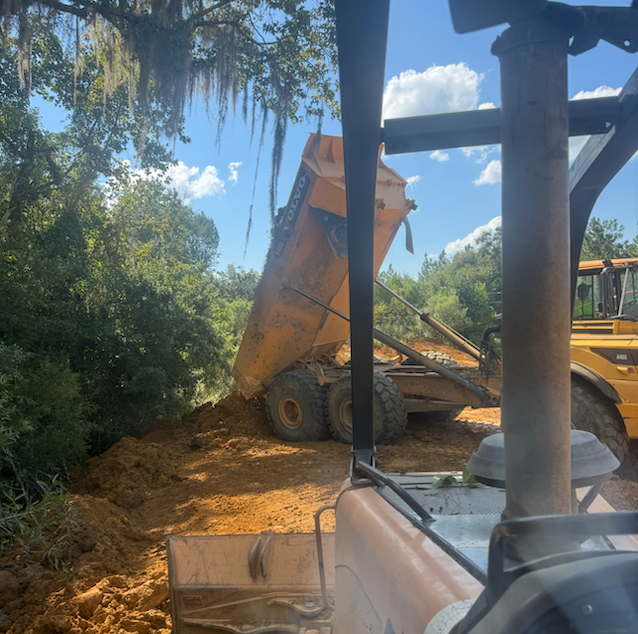 Dump truck hauling gravel for driveway project in Warner Robins GA
