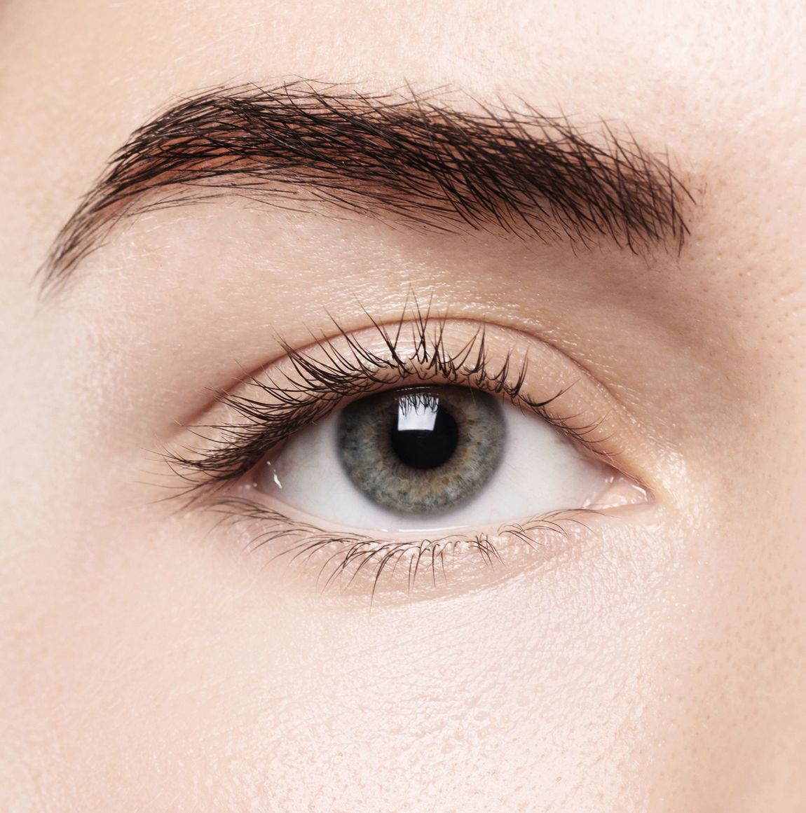 a close up of a woman 's eye with mascara on it