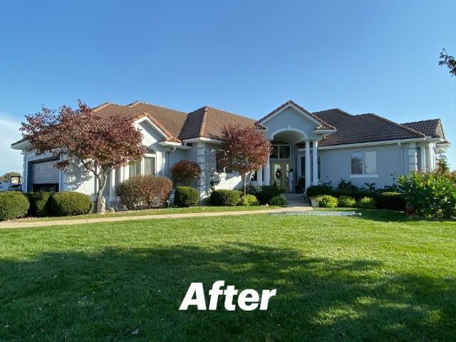 A picture of a house after being painted white
