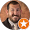 A man with a beard is smiling in a circle with an orange star.