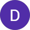 The letter d is in a purple circle on a white background.