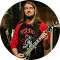 A man with long hair is holding a guitar in a circle.