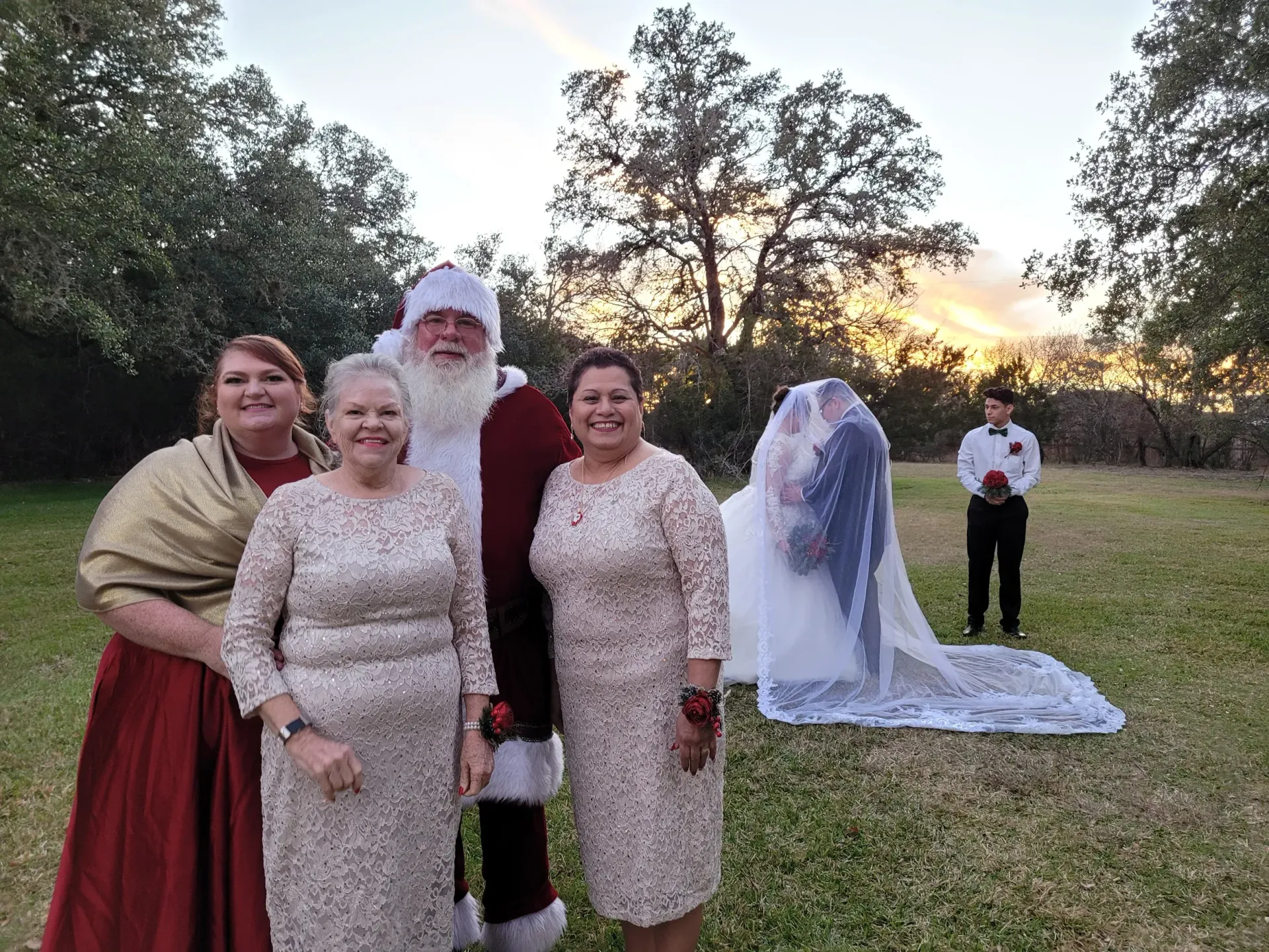 A group of people are posing for a picture with santa claus.