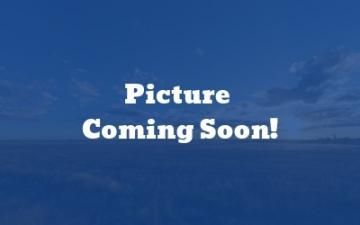 Blue placeholder screen with white text reading “Picture Coming Soon!”