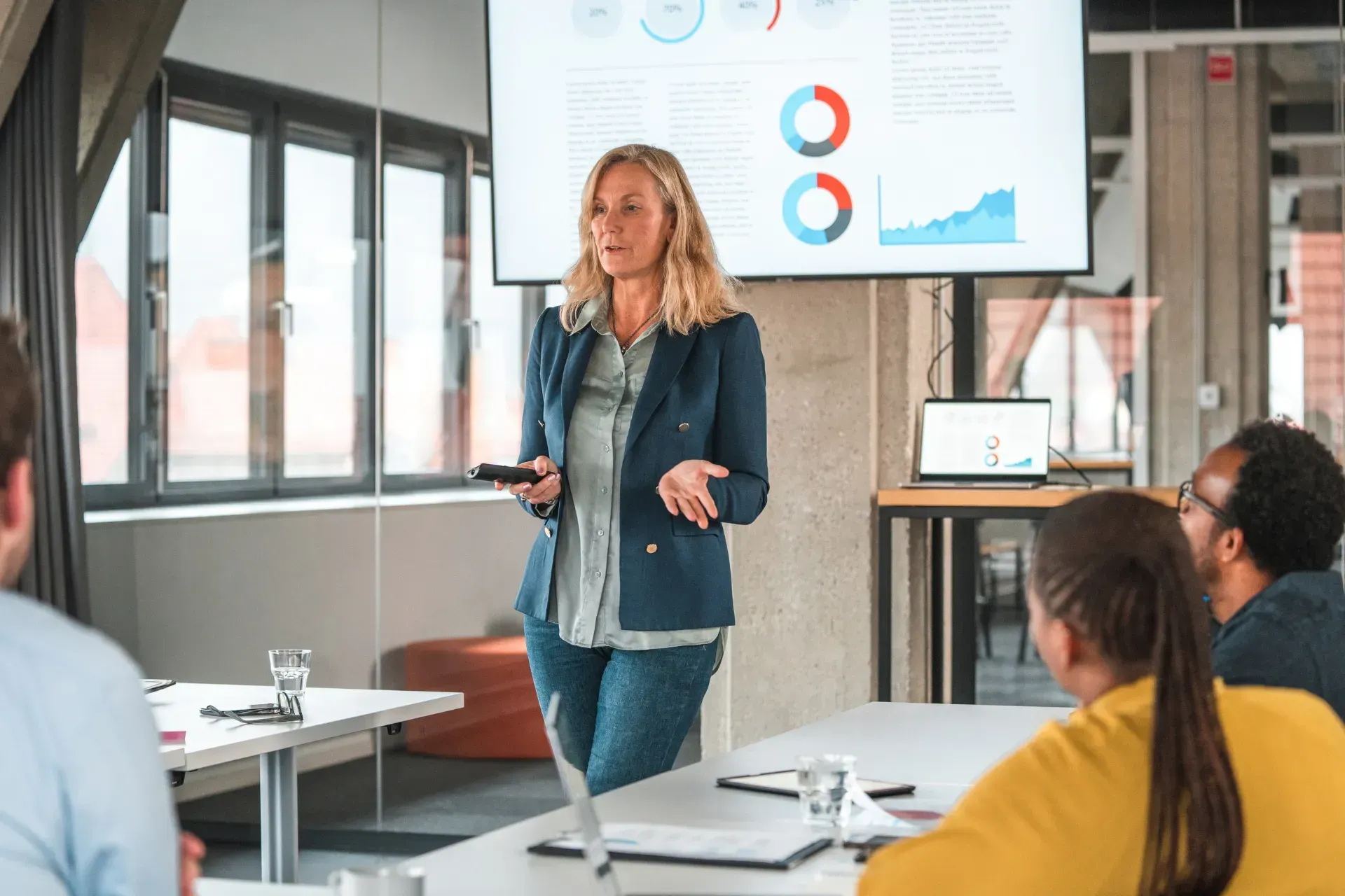 A person is using a calculator and writing on a piece of paper.