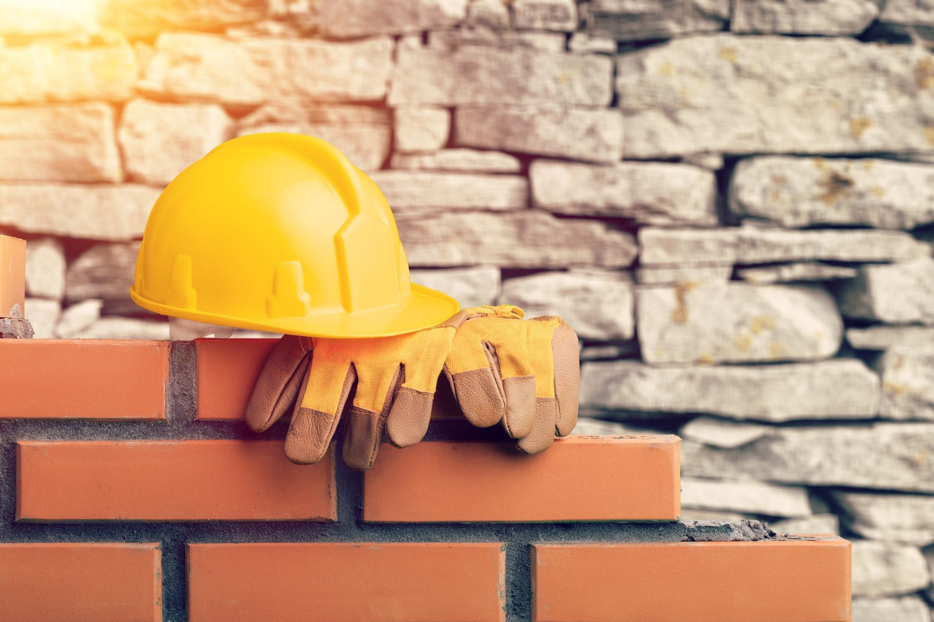 Construction elements highlighting commercial bricklaying with workers and building materials.