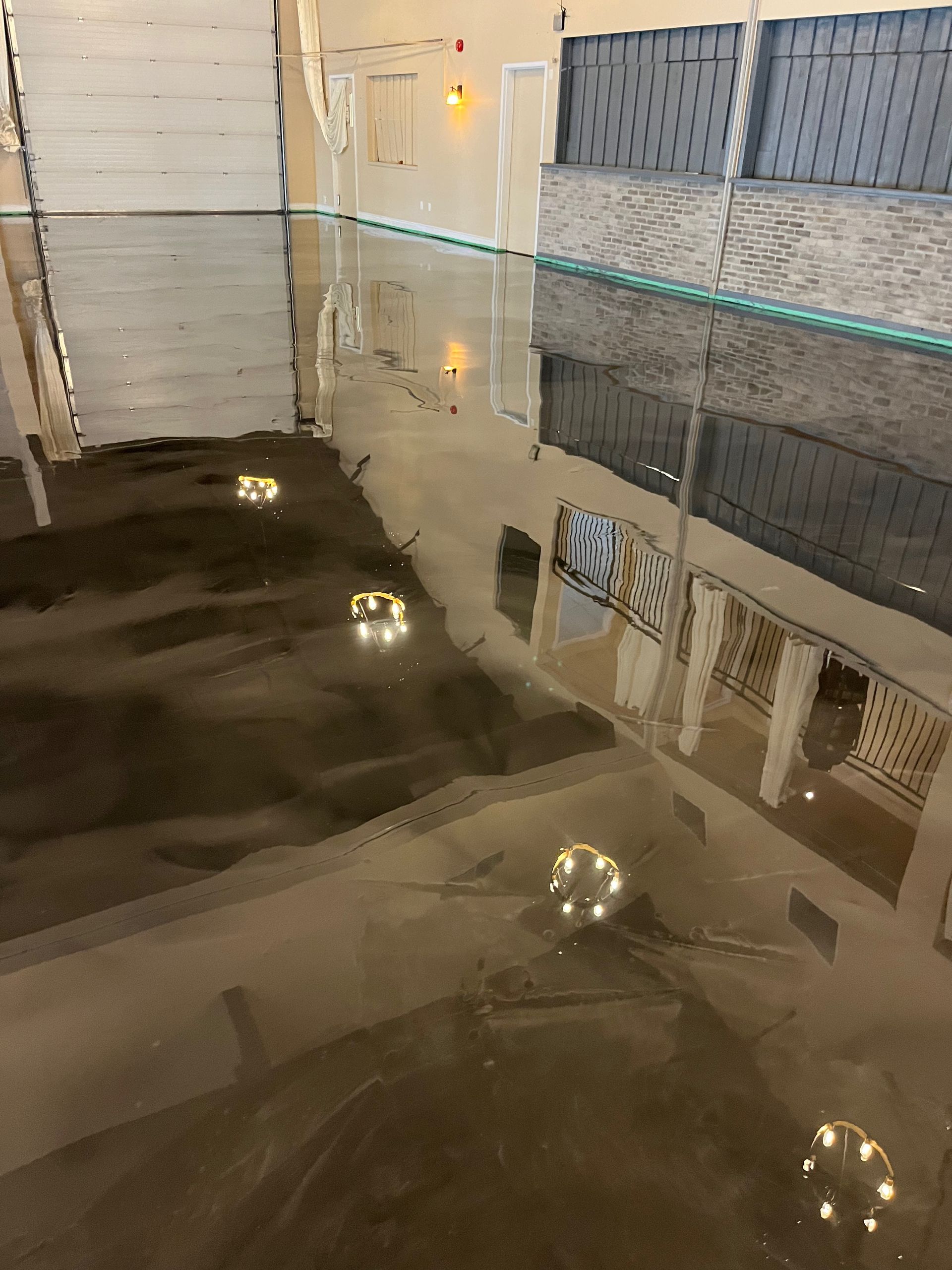 A table with a reflection of a building in the water.