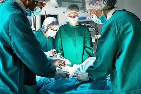 Doctors in surgery operating on patient
