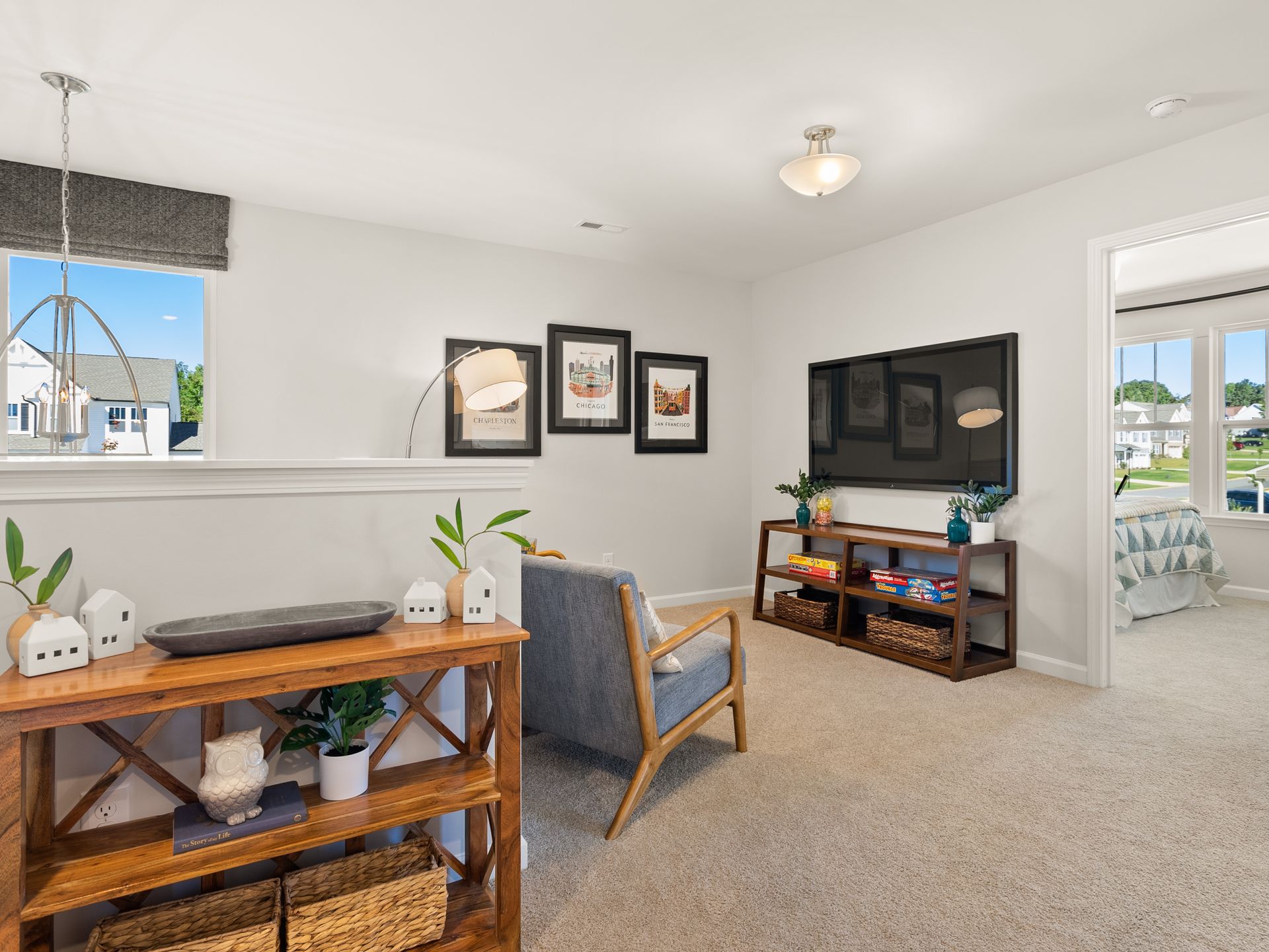 A living room with a couch , chair , and television.