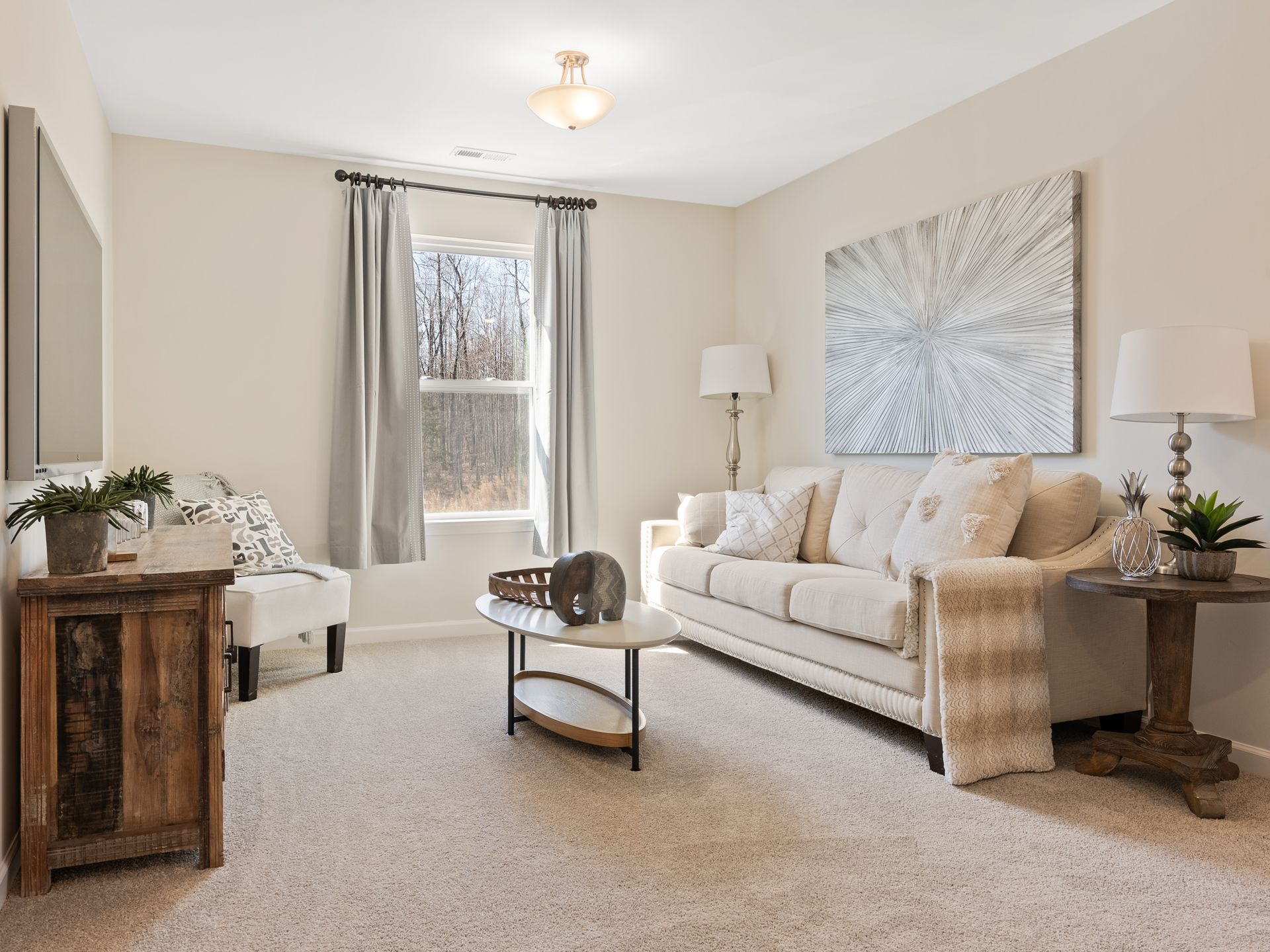 A living room with a couch , coffee table , and television.