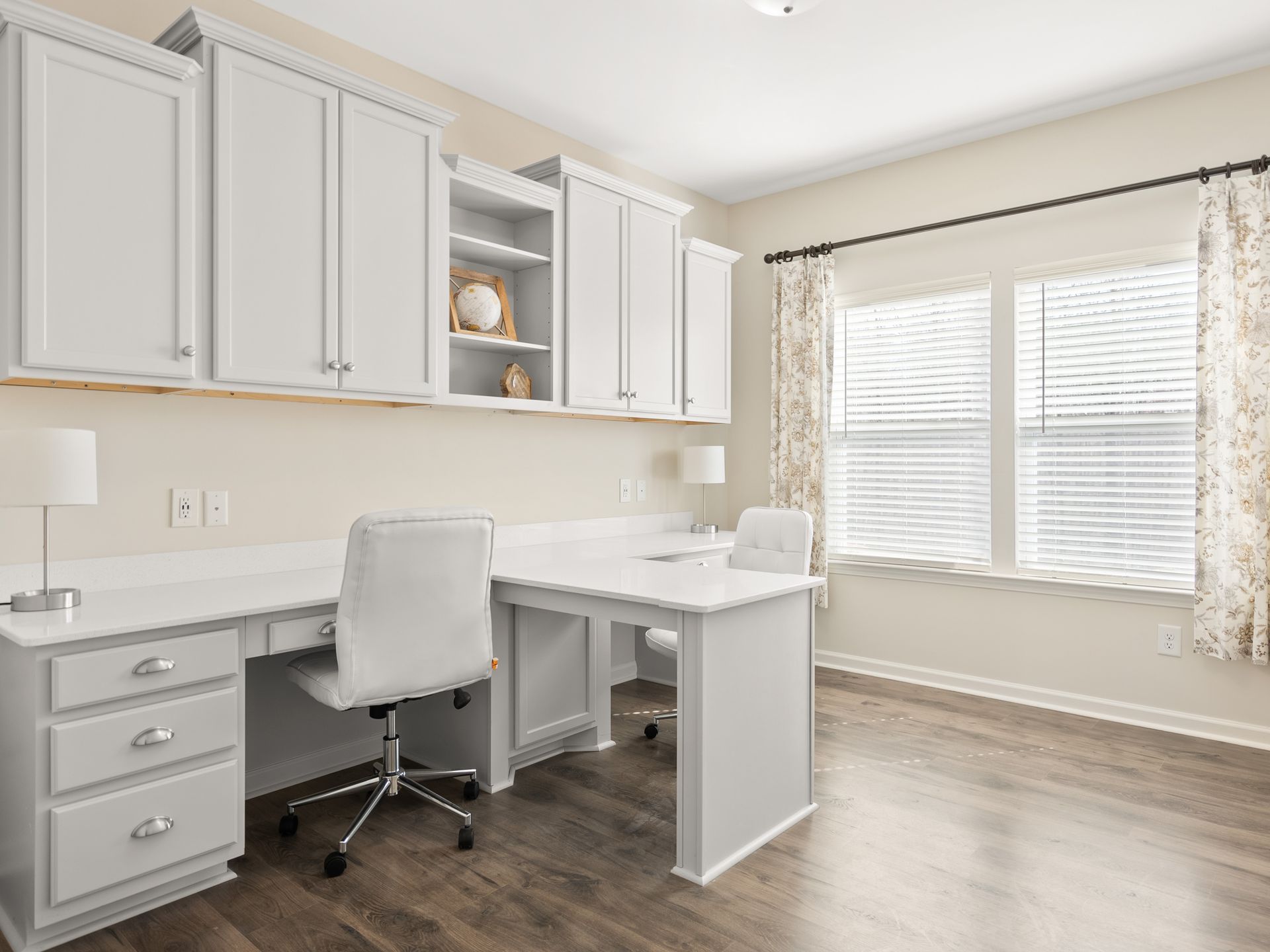 There is a desk and chair in the room.