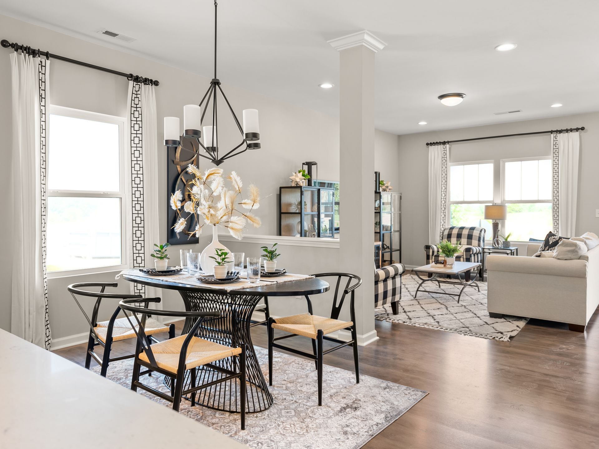 There is a dining room table and chairs in the middle of the room.