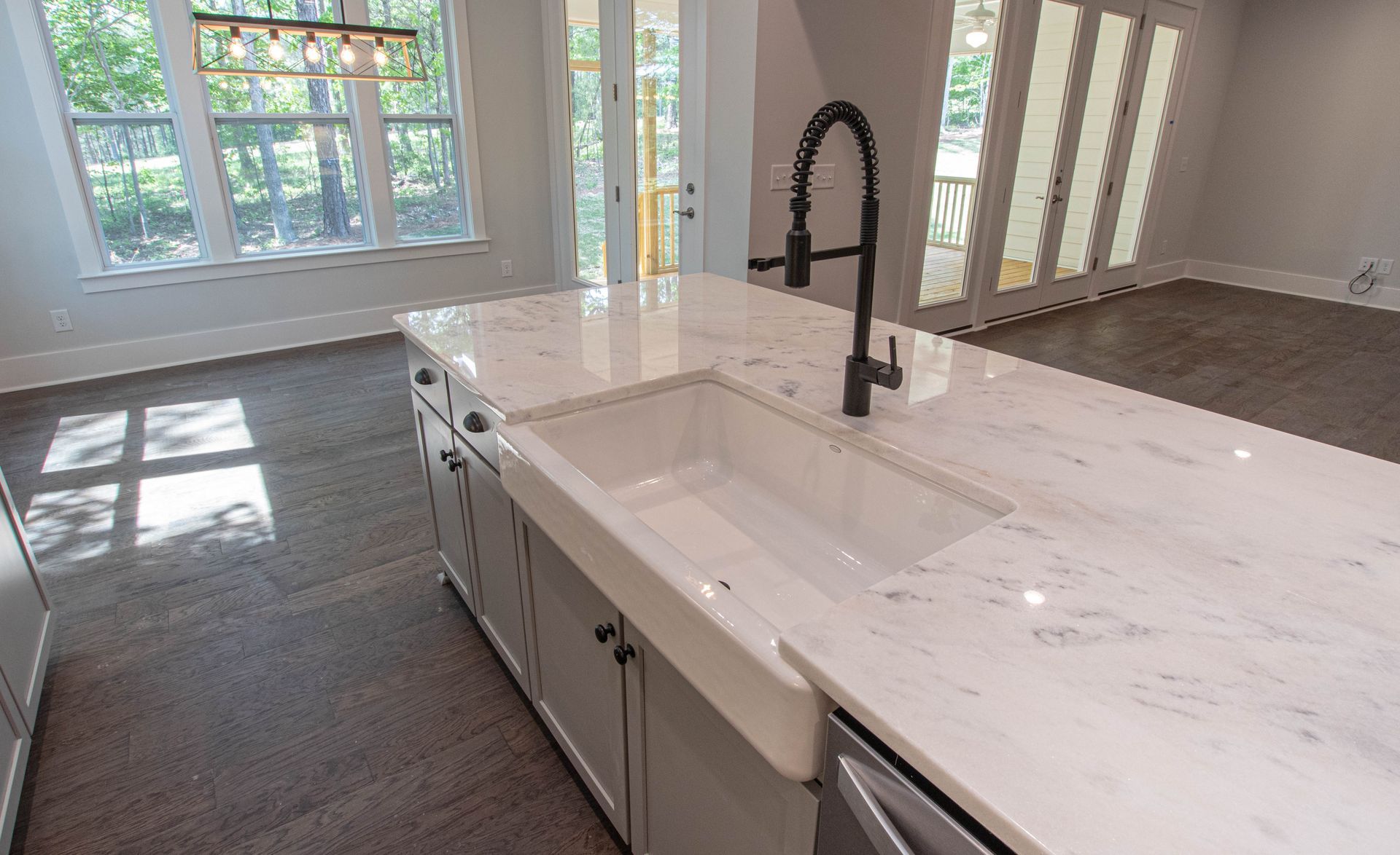 A kitchen with a sink and a faucet in it