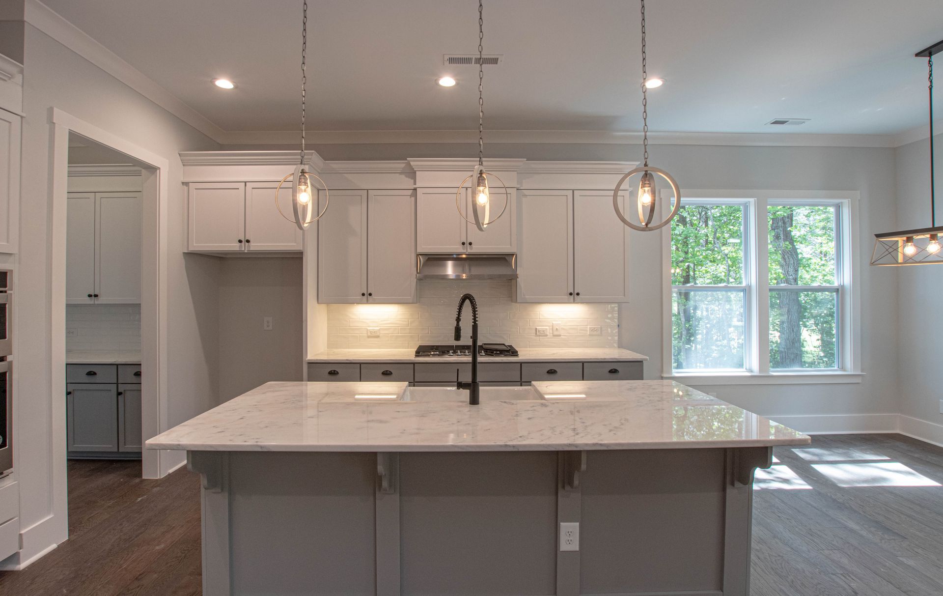 There is a large island in the middle of the kitchen.