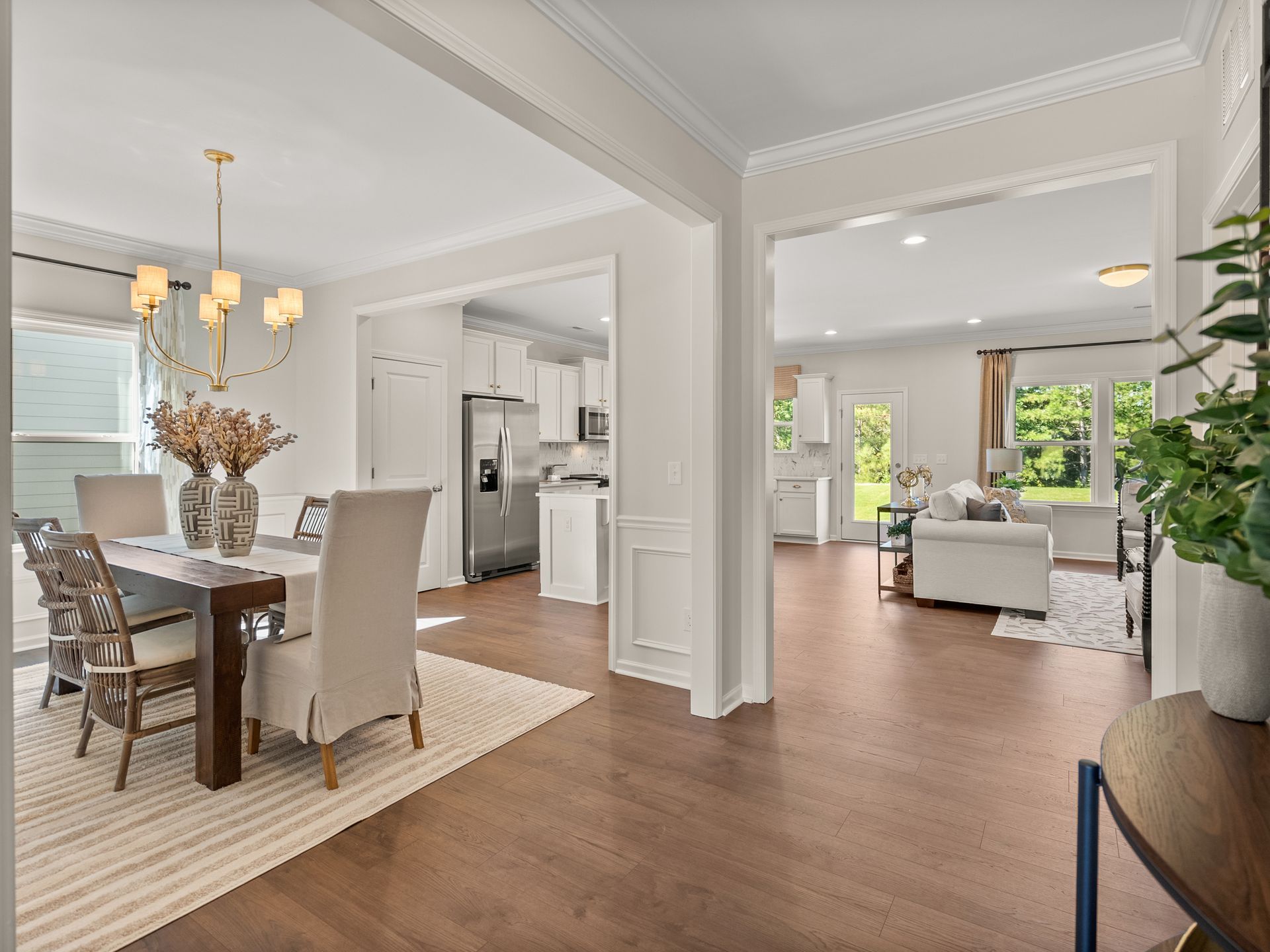 There is a dining room table and chairs in the middle of the room.