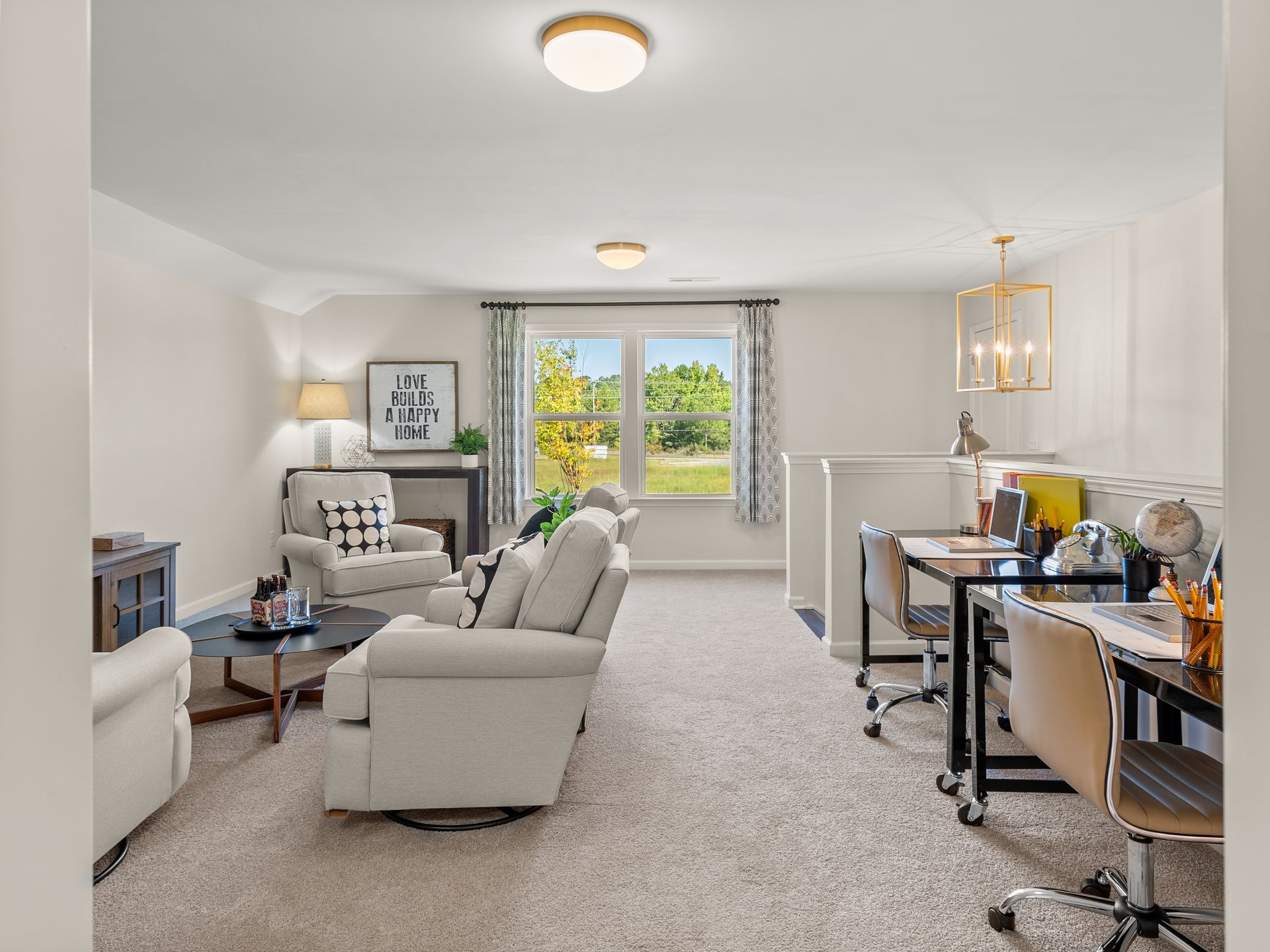 A living room with a couch , chairs , and a desk.