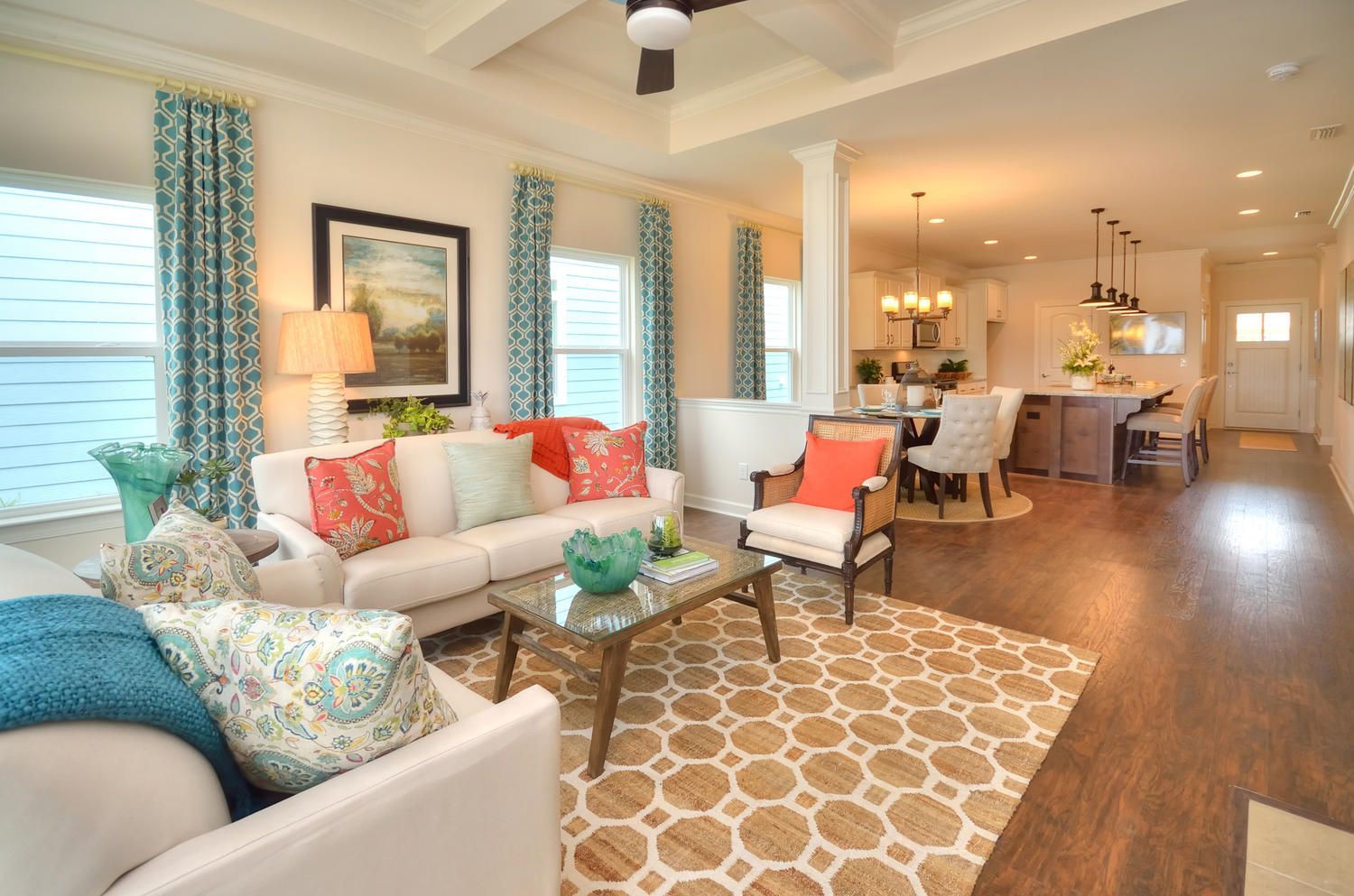 A living room filled with furniture and a ceiling fan.